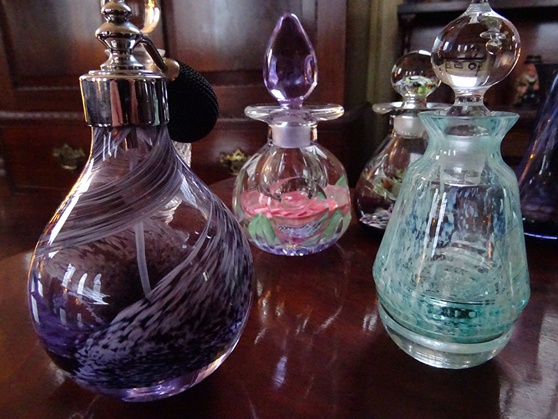 Collection of glass perfume bottles and vases